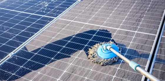Solar panels being cleaned with a cleaning tool